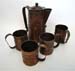 BRASS AND COPPER PITCHER WITH MUGS